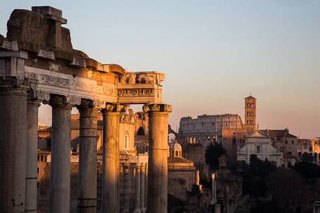 Sunset light on the Roman Forums, the Colosseum in the background Sunset light on the Roman Forums, the Colosseum in the background