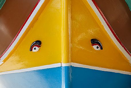 Detail of luzzu, traditional fishing boat with Phoenician eyes in the historic city of Marsaxlokk on the island of Malta, Europe