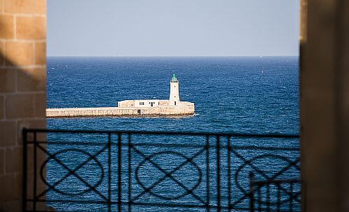 St. Elmo Breakwater Lighthouse, Grand Harbor, La Valletta, capital city of the island of Malta.