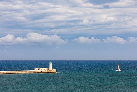 St. Elmo Breakwater Lighthouse, Grand Harbor, La Valletta, capital city of the island of Malta.