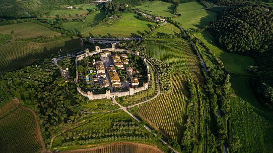 Aerial view of Monteriggioni village. It is a complete walled medieval town in the Siena Province of Tuscany built in the 13th century, Italy, Europe Aerial view of Monteriggioni village. It is a complete walled medieval town in the Siena Province of Tuscany built in the 13th century, Italy, Europe