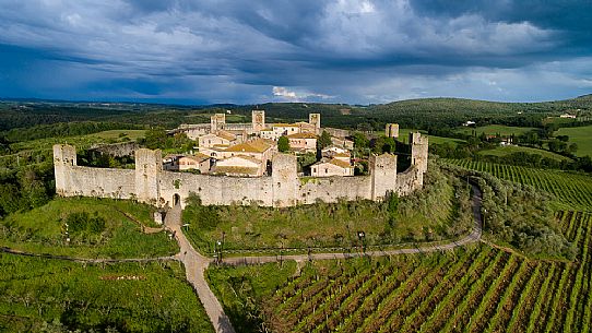 Aerial view of Monteriggioni village. It is a complete walled medieval town in the Siena Province of Tuscany built in the 13th century, Italy, Europe Aerial view of Monteriggioni village. It is a complete walled medieval town in the Siena Province of Tuscany built in the 13th century, Italy, Europe