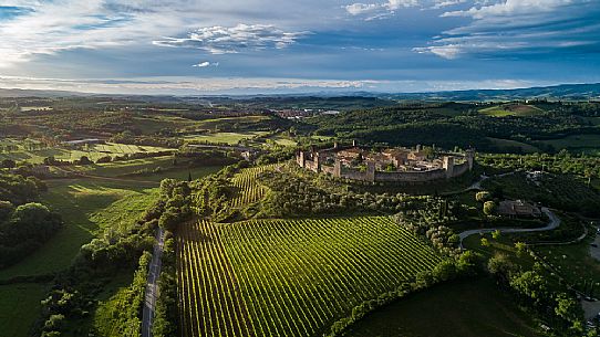 Aerial view of Monteriggioni village. It is a complete walled medieval town in the Siena Province of Tuscany built in the 13th century, Italy, Europe Aerial view of Monteriggioni village. It is a complete walled medieval town in the Siena Province of Tuscany built in the 13th century, Italy, Europe