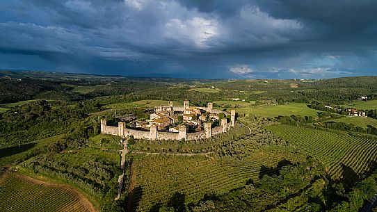Aerial view of Monteriggioni village. It is a complete walled medieval town in the Siena Province of Tuscany built in the 13th century, Italy, Europe Aerial view of Monteriggioni village. It is a complete walled medieval town in the Siena Province of Tuscany built in the 13th century, Italy, Europe