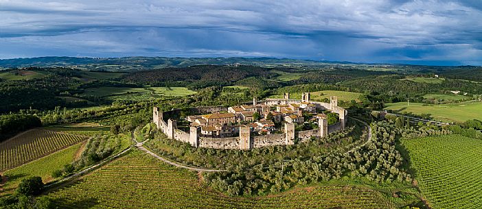 Aerial view of Monteriggioni village. It is a complete walled medieval town in the Siena Province of Tuscany built in the 13th century, Italy, Europe Aerial view of Monteriggioni village. It is a complete walled medieval town in the Siena Province of Tuscany built in the 13th century, Italy, Europe