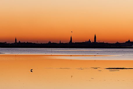 The Venetian lagoon and in the background the Venice island at sunset from Burano, Veneto, Italy, Europe