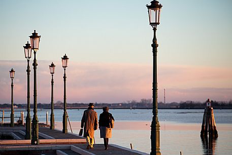 Elderly couple walking in Venice, Veneto, Italy, Europe