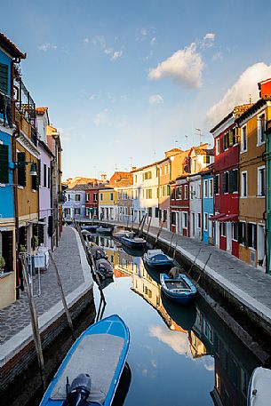 Colorful houses in Burano with canal and moored boats, Venice, Venetian lagoon, Veneto, Italy, Europe