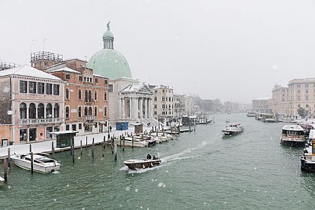 Venice in a snowy day, San Simeone church and the medieval houses from Scalzi bridge on the Grand Canal, Italy, Europe Venice in a snowy day, San Simeone church and the medieval houses from Scalzi bridge on the Grand Canal, Italy, Europe