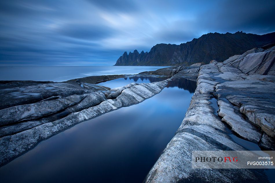 Moody sunset at Tungeneset, on Senja Island. In the background the famous Devil's Teeth.