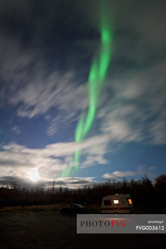 Northern lights, moon and caravan over Kilpisjrvi, Norway.
