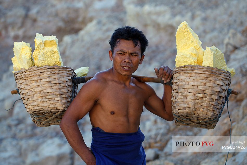 Sulfur bearer at Ijen Crater, Isle of Java.