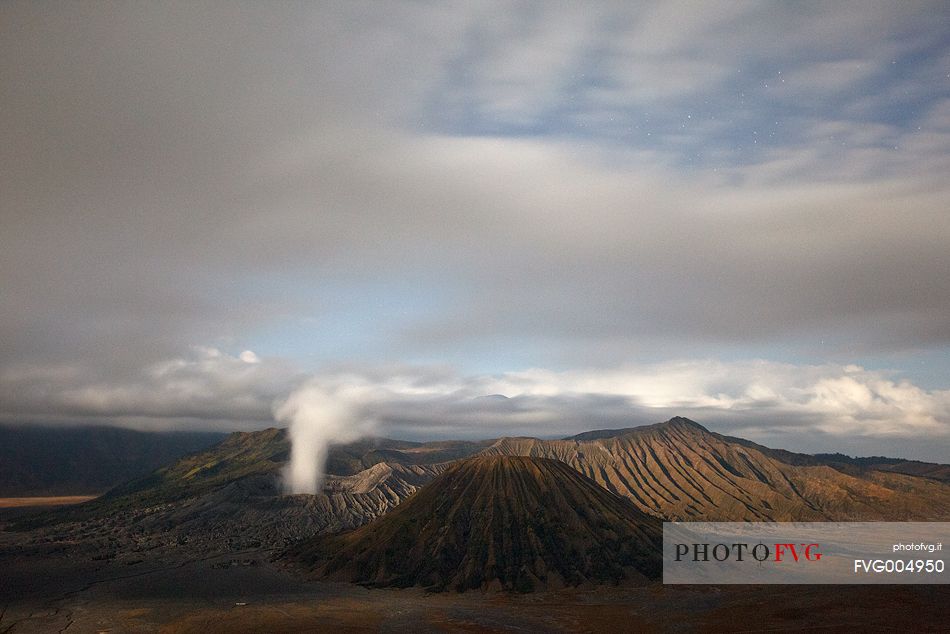 Starry night and smoking volcano, Bromo Tengger Semeru National Park, Isle of Java.