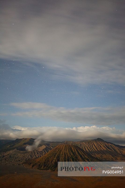 Starry night and smoking volcano, Bromo Tengger Semeru National Park, Isle of Java.