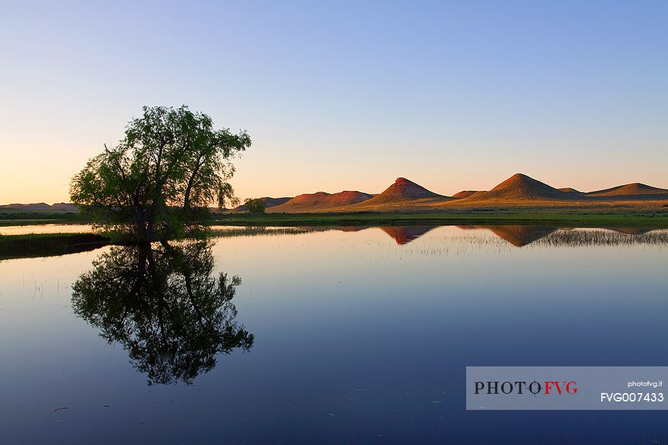 A calm and atypical landscape of Wyoming at sunset.