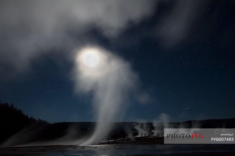 Beautiful nigh, full moon and geysers close to the Grand Prismatic Spring, Yellowstone National Park, Wyoming.