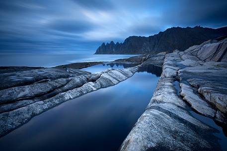 Moody sunset at Tungeneset, on Senja Island. In the background the famous Devil's Teeth.