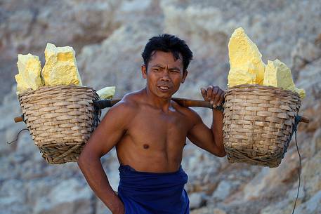 Sulfur bearer at Ijen Crater, Isle of Java.