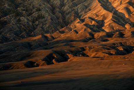 Volcanic terrain illuminated by the first light of sunrise, Bromo Tengger Semeru National Park.