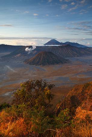 Th smoking volcanoes of Bromo Tengger Semeru National Park after sunrise, Isle of Java.