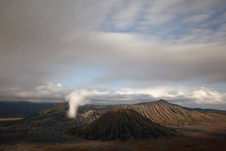 Starry night and smoking volcano, Bromo Tengger Semeru National Park, Isle of Java. Starry night and smoking volcano, Bromo Tengger Semeru National Park, Isle of Java.