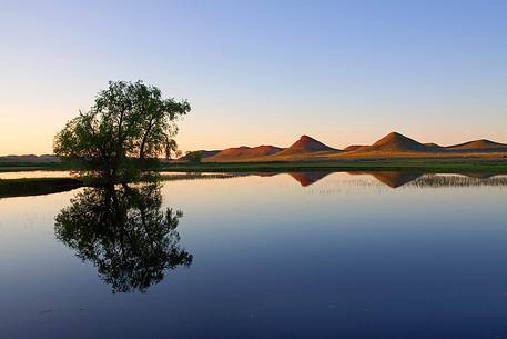 A calm and atypical landscape of Wyoming at sunset.