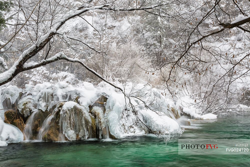 Frozen lakes and waterfalls in Plitvice Lakes National Park, Croatia