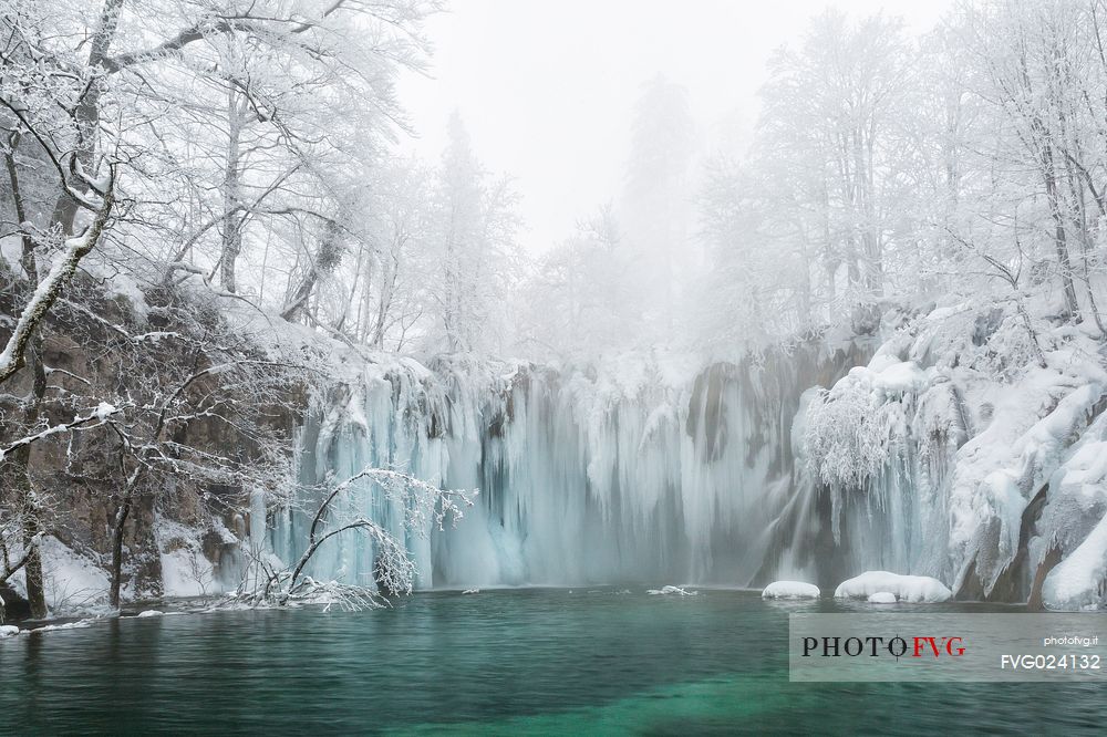 Frozen lakes and waterfalls in Plitvice Lakes National Park, Croatia