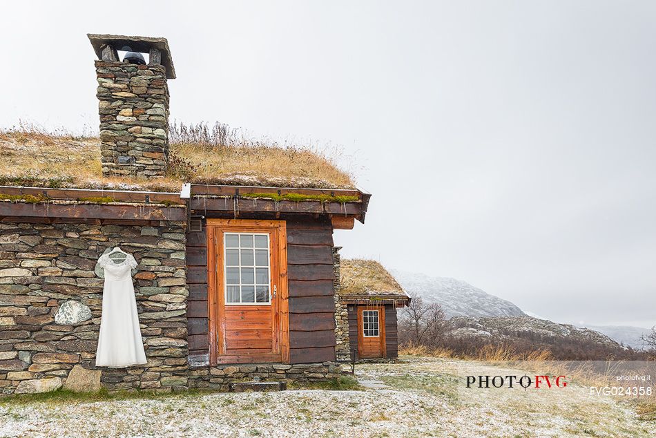 Wedding dress hanging out of the raditional building in Harahorn, Norway