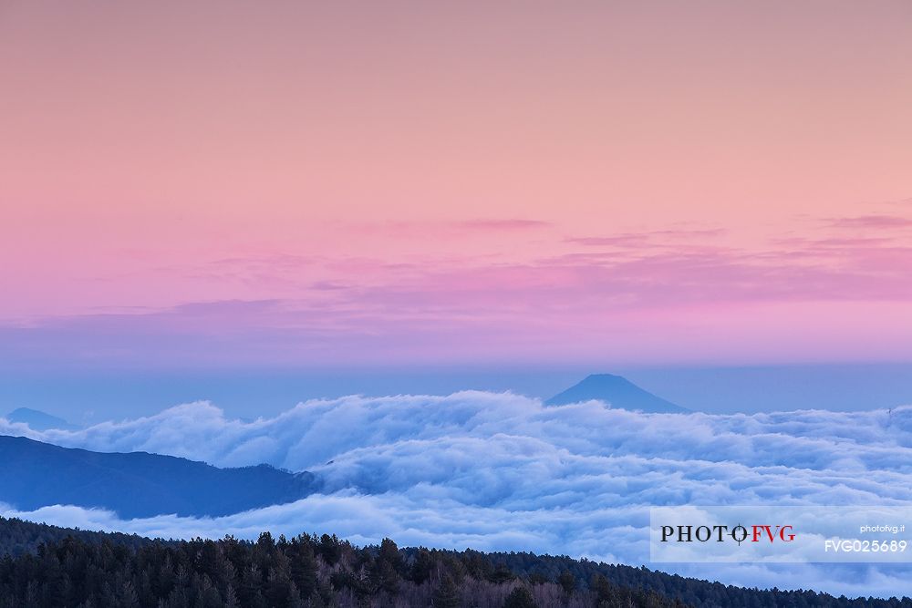 Etna, sunrise from Sartorius mountais, forward volcano Stromboli in the background,Sicily, Italy