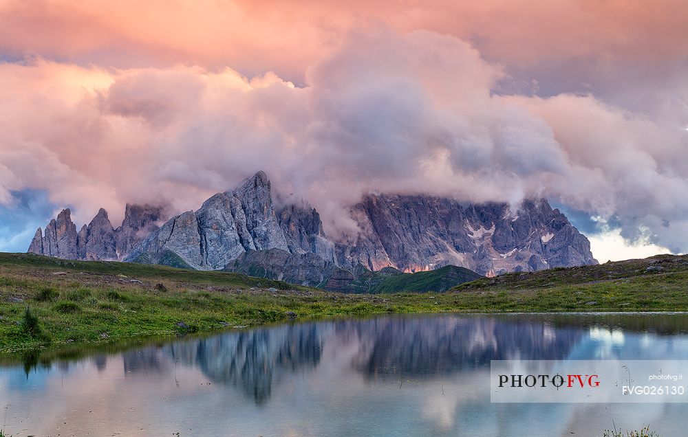 Sunrise at Cavia Lake and in the backgroud the Pale di San Martino dolomites, Passo San Pellegrino, Italy