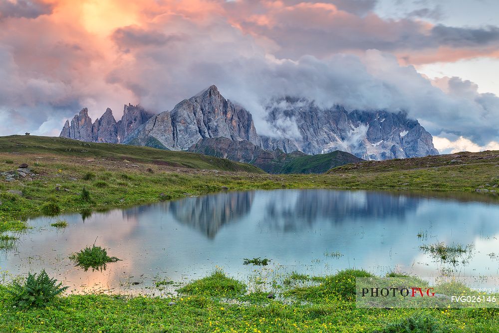 Sunrise at Cavia Lake and in the backgroud the Pale di San Martino dolomites, Passo San Pellegrino, Italy