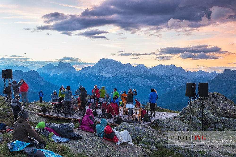 Sounds of the Dolomites, the high altitude music festival in Trentino.  At Sunrise many people listen to a concert on Col Margherita, dolomites, Italy