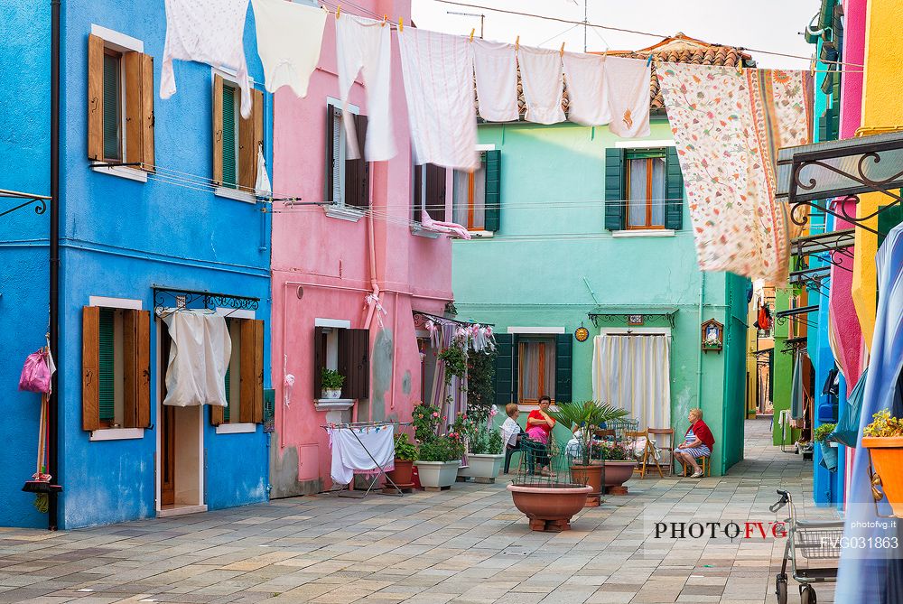 Lifestyle in Burano village where every house is painted different color, Venice, Italy