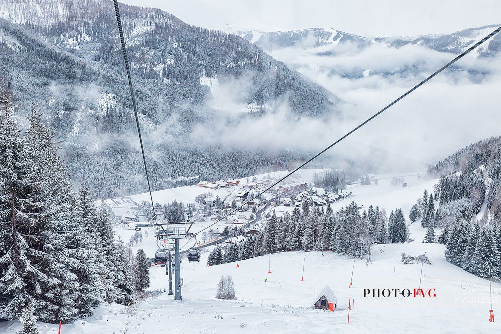 The Brunnach ski area and the traditional village of St Oswald in the clouds, Bad Kleinkirchheim, Carinthia, Austria, Europe