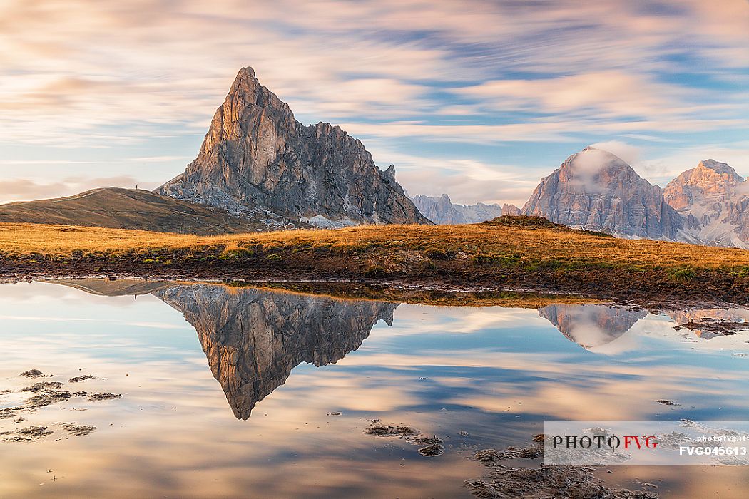 Giau Pass before sunset, Gusela and Tofana mounts reflected on pond, dolomites, Cortina d'Ampezzo, Veneto, Italy, Europe