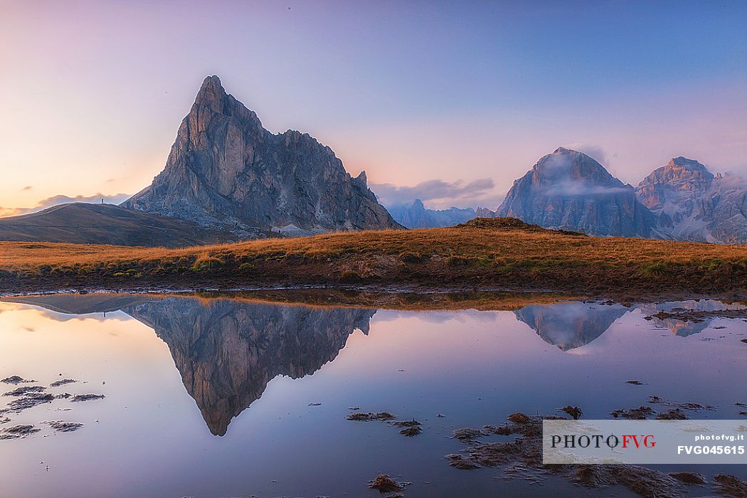 Giau Pass at twilight, Gusela and Tofana mounts reflected on pond, dolomites, Cortina d'Ampezzo, Veneto, Italy, Europe