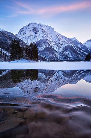 Julian Alps, winter view to the Lake Predil, natural alpine lake