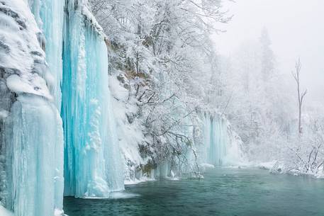 Frozen lakes and waterfalls in Plitvice Lakes National Park, Croatia