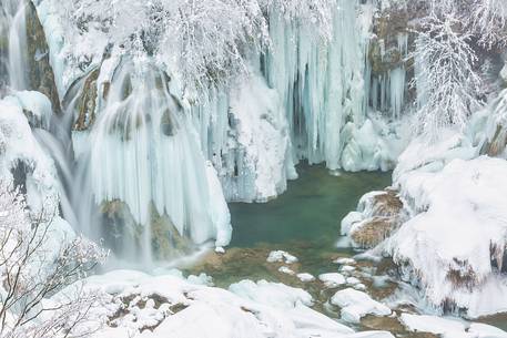 Frozen lakes and waterfalls in Plitvice Lakes National Park, Croatia