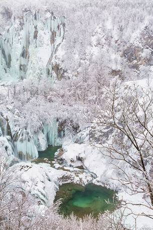 Frozen lakes and waterfalls in Plitvice Lakes National Park, Croatia