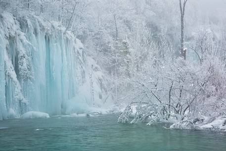 Frozen lakes and waterfalls in Plitvice Lakes National Park, Croatia