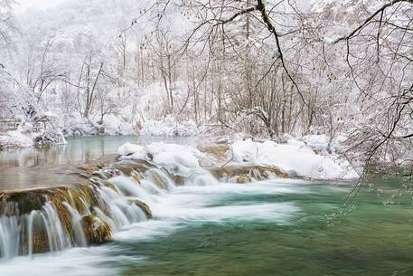 Frozen lakes and waterfalls in Plitvice Lakes National Park, Croatia