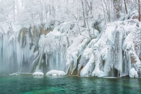 Frozen lakes and waterfalls in Plitvice Lakes National Park, Croatia