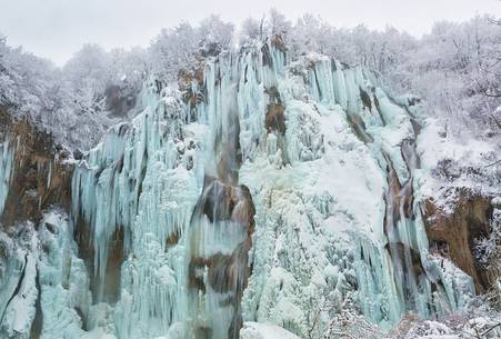 Frozen lakes and waterfalls in Plitvice Lakes National Park, Croatia