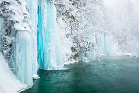 Frozen lakes and waterfalls in Plitvice Lakes National Park, Croatia