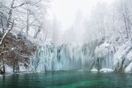 Frozen lakes and waterfalls in Plitvice Lakes National Park, Croatia