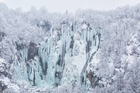 Frozen lakes and waterfalls in Plitvice Lakes National Park, Croatia