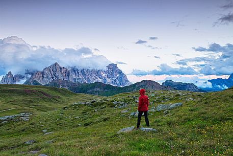 Hiker admires the Pale di San Martino mountains, Col Margherita, Trentino, Italy Hiker admires the Pale di San Martino mountains, Col Margherita, Trentino, Italy