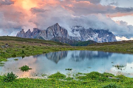 Sunrise at Cavia Lake and in the backgroud the Pale di San Martino dolomites, Passo San Pellegrino, Italy